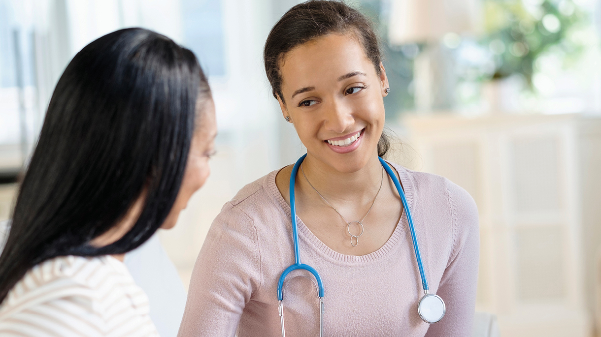 Doctor speaking with patient