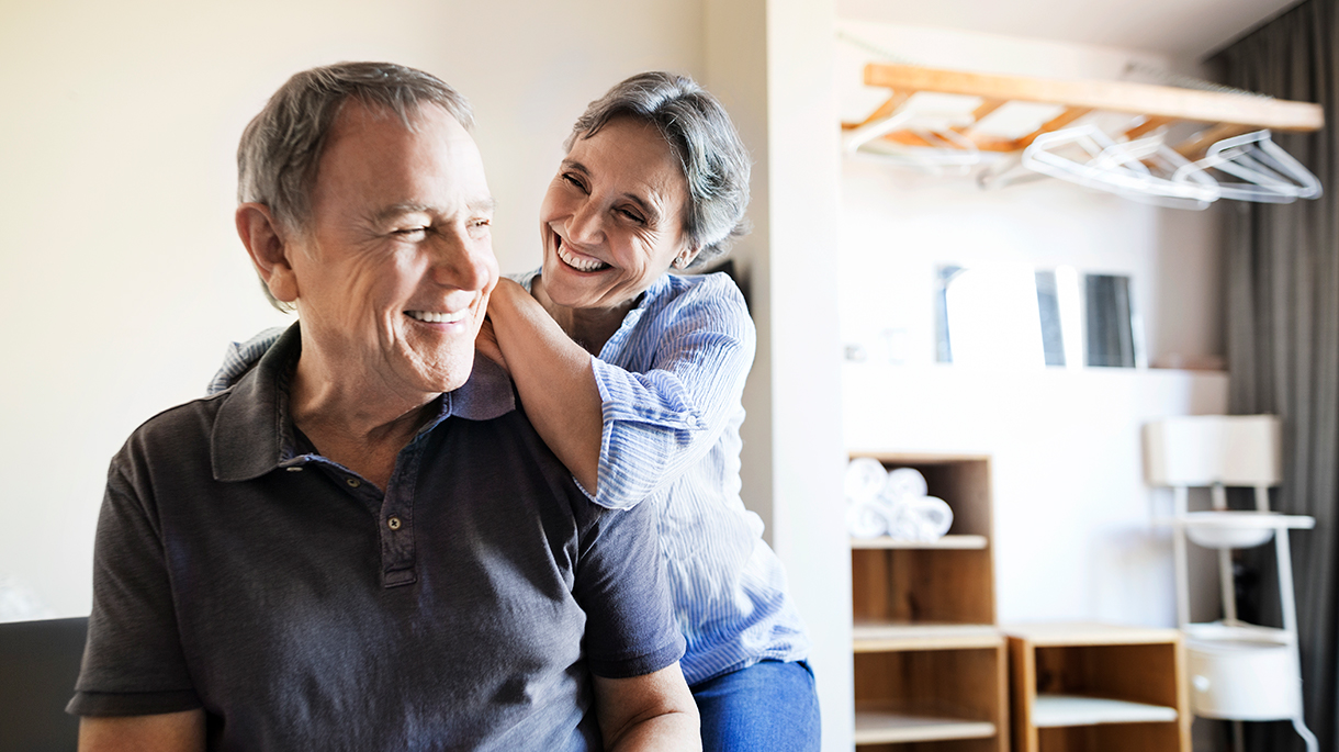 Middle aged man and woman smiling